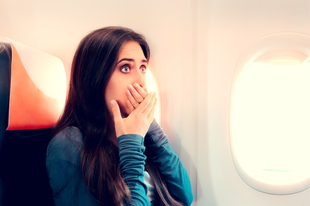 shocked woman on airplane