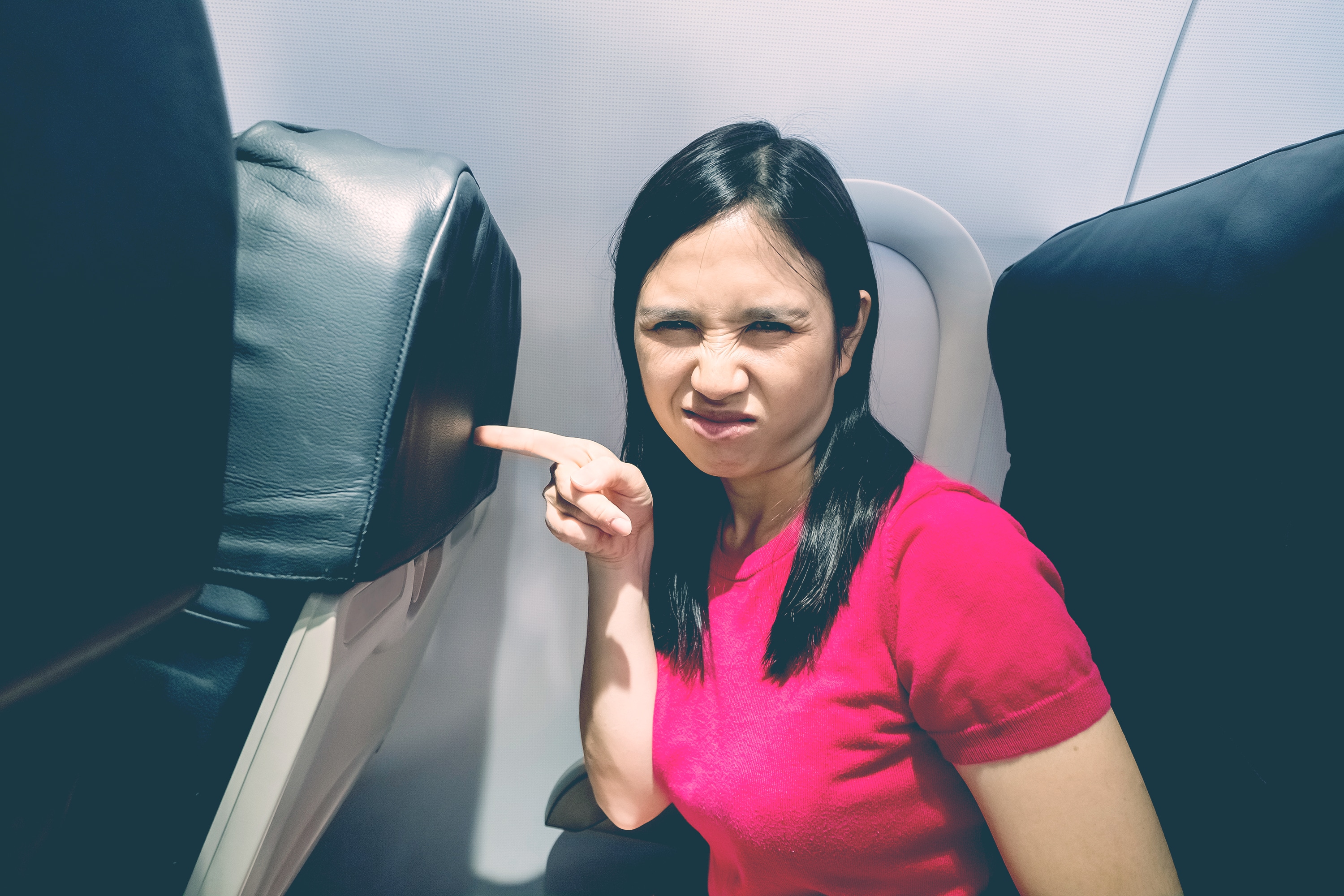 angry woman in plane